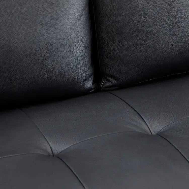 Divano moderno in vera pelle con gambe in legno e cuscino a rullo aggiuntivo